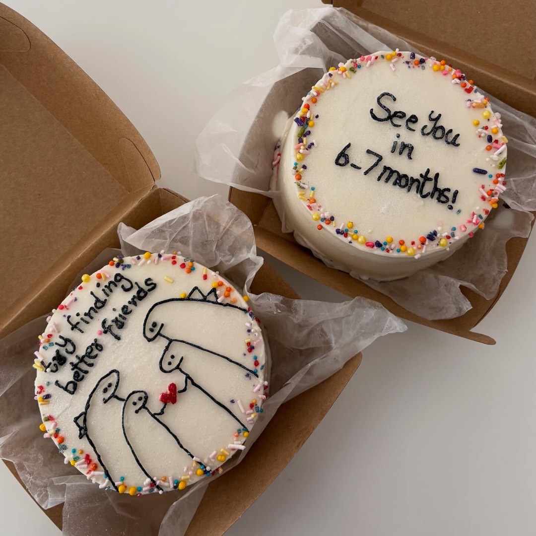 Two bento cakes with hand-piped messages